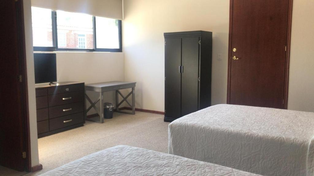 Postel nebo postele na pokoji v ubytování HOTEL CANDELERO
