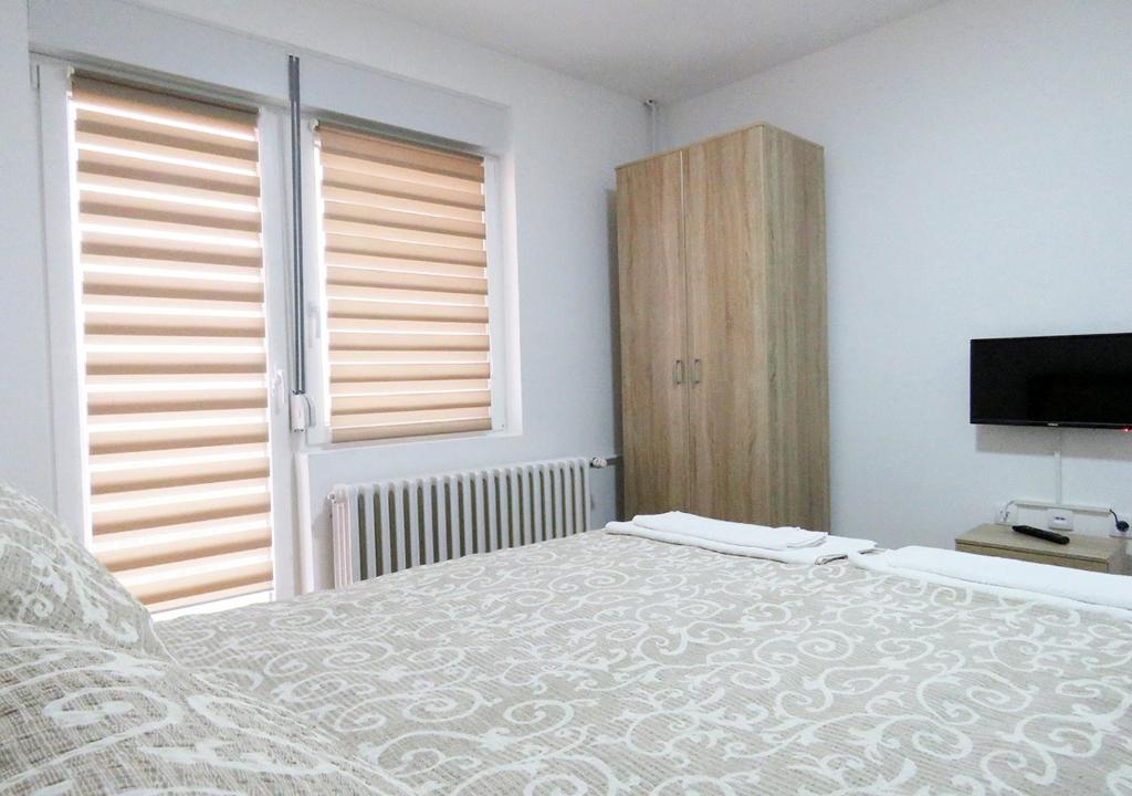 Postel nebo postele na pokoji v ubytování Akvarius