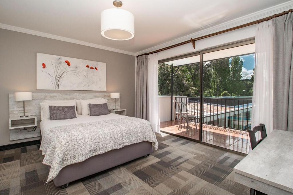 Postel nebo postele na pokoji v ubytování 202 Hotel Boutique