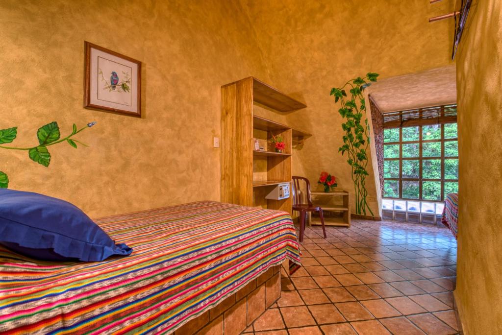 Postel nebo postele na pokoji v ubytování El Sano Banano Beachside Hotel