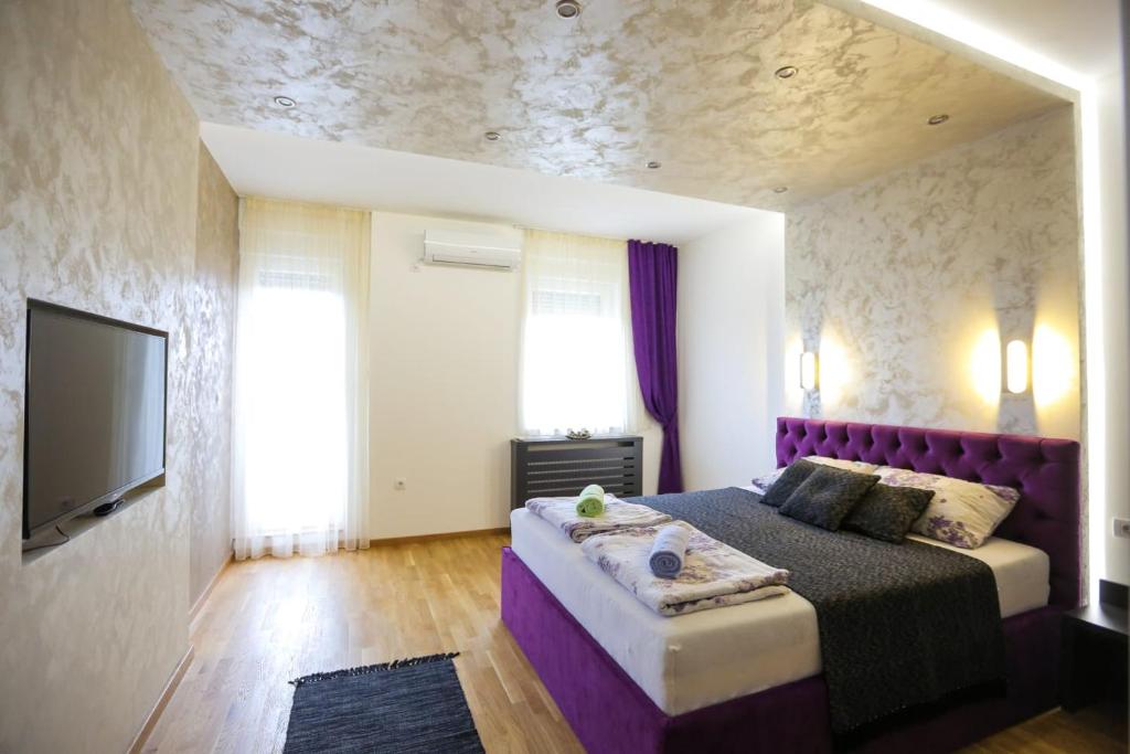 Lova arba lovos apgyvendinimo įstaigoje VMAKS Apartman - Kraljev park