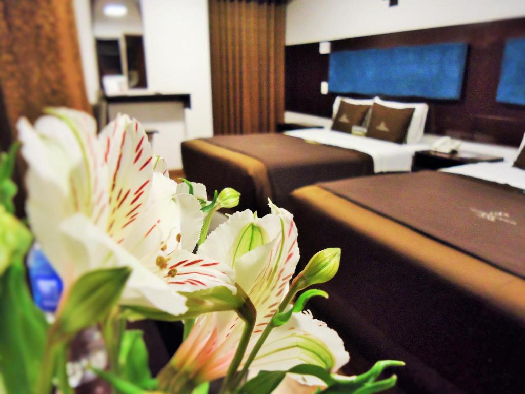 Postel nebo postele na pokoji v ubytování San Francisco Cusco Hotel