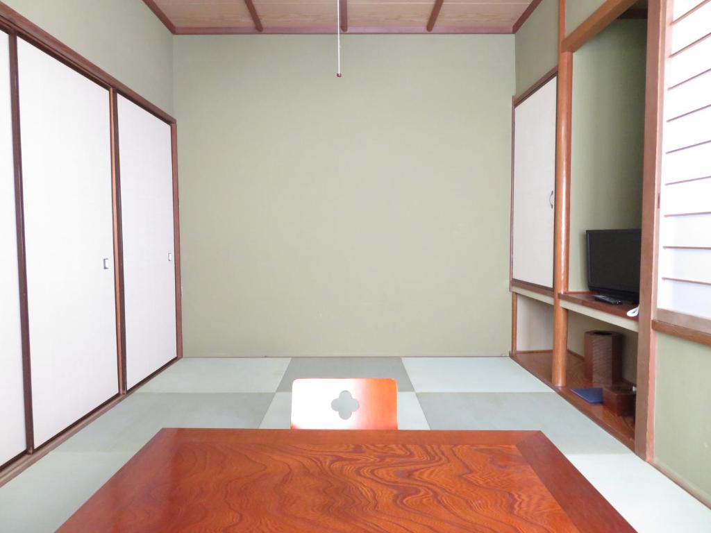 Postel nebo postele na pokoji v ubytování Hakone Miyanoshita Myojokan