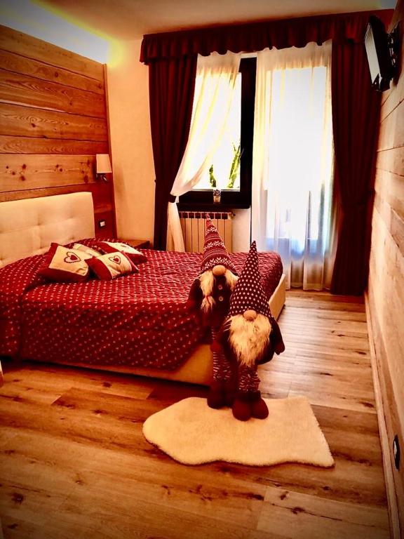 Postel nebo postele na pokoji v ubytování Albergo Garni Martina