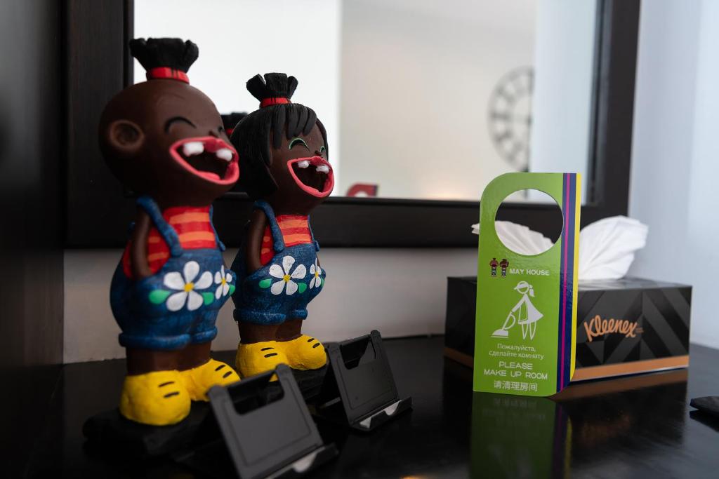 two stuffed animals standing next to each other on a table at May House Karon Beach in Karon Beach