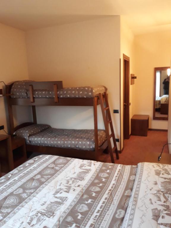 Postel nebo postele na pokoji v ubytování Albergo Piazzatorre