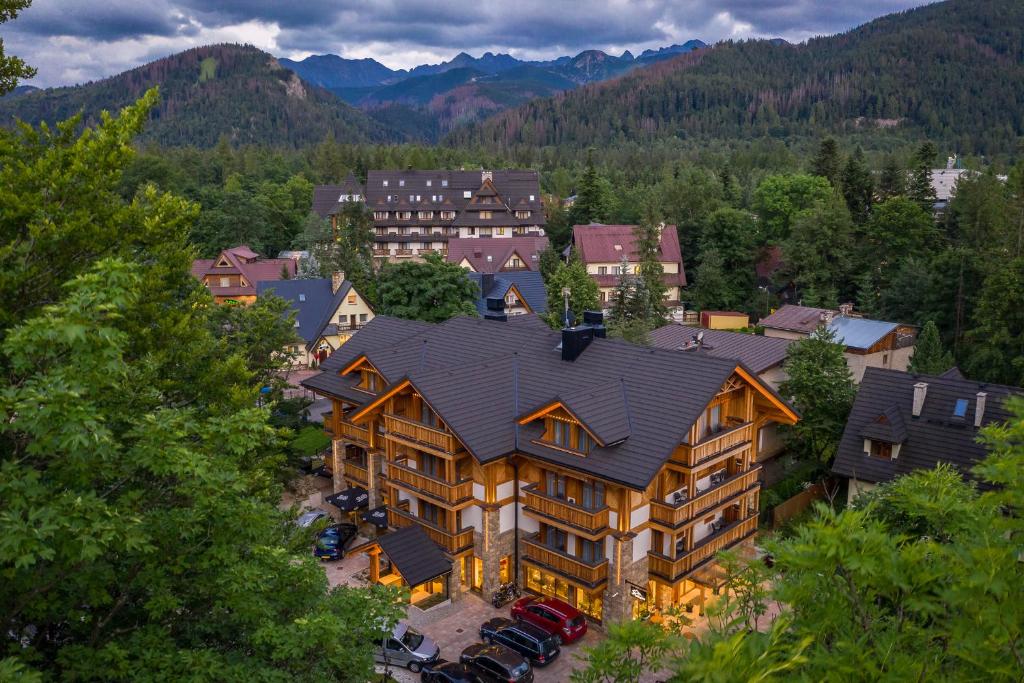 an aerial view of a large house in the mountains at Hotel Foluszowy Potok in Zakopane