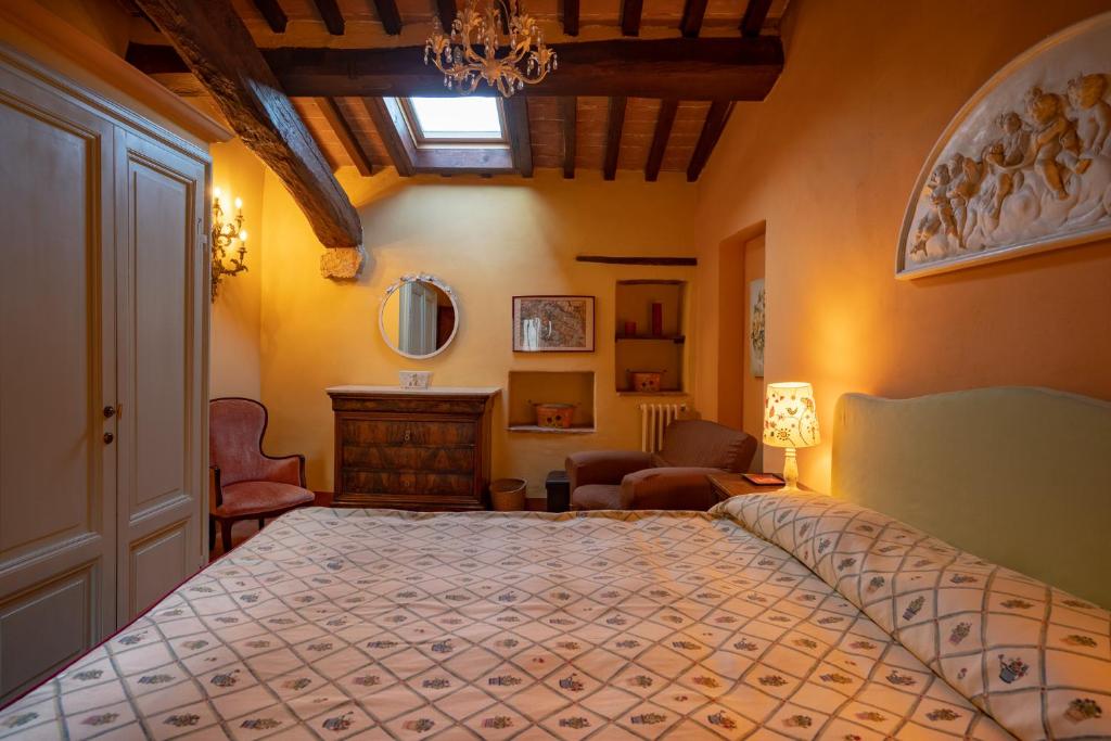 Łóżko lub łóżka w pokoju w obiekcie Torraccia di Chiusi Agriturismo Relais
