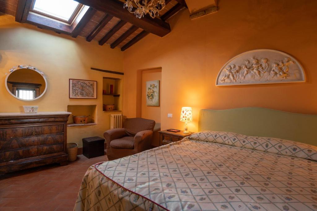 Łóżko lub łóżka w pokoju w obiekcie Torraccia di Chiusi Agriturismo Relais