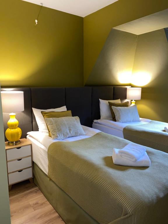 Postel nebo postele na pokoji v ubytování Apartamenty Nova 22