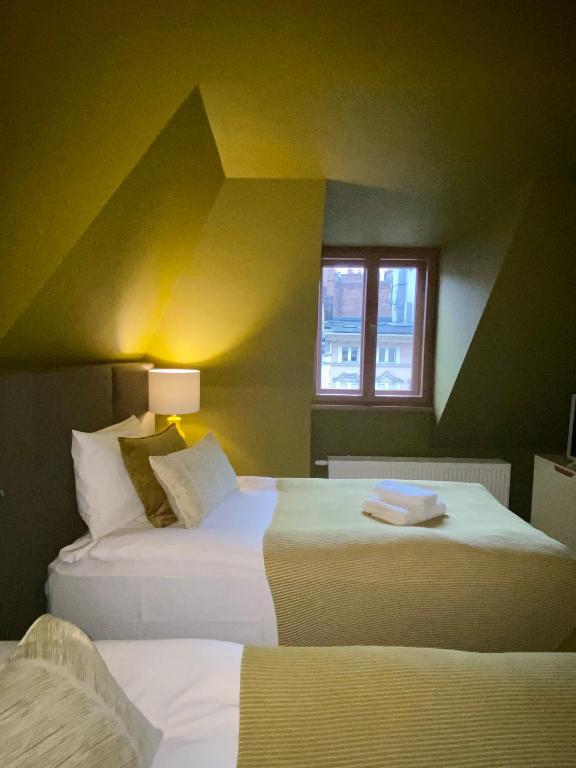Postel nebo postele na pokoji v ubytování Apartamenty Nova 22