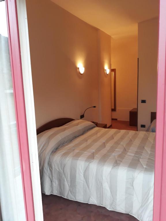 Postel nebo postele na pokoji v ubytování Albergo Piazzatorre