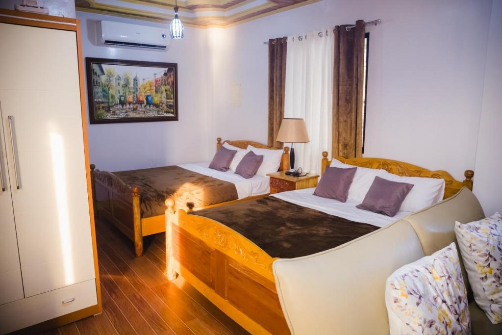 Postel nebo postele na pokoji v ubytování Villa Marii