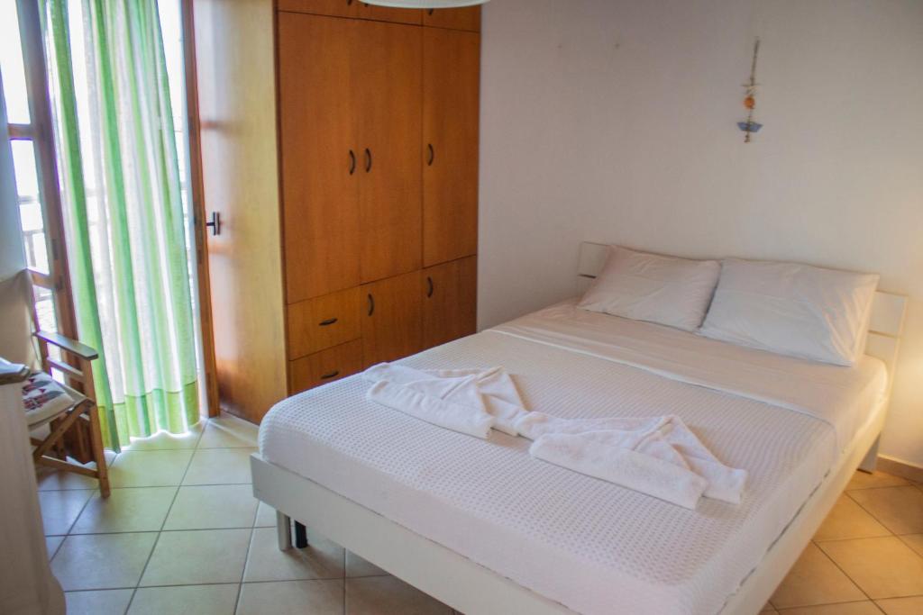 Postel nebo postele na pokoji v ubytování Koilon Apartments