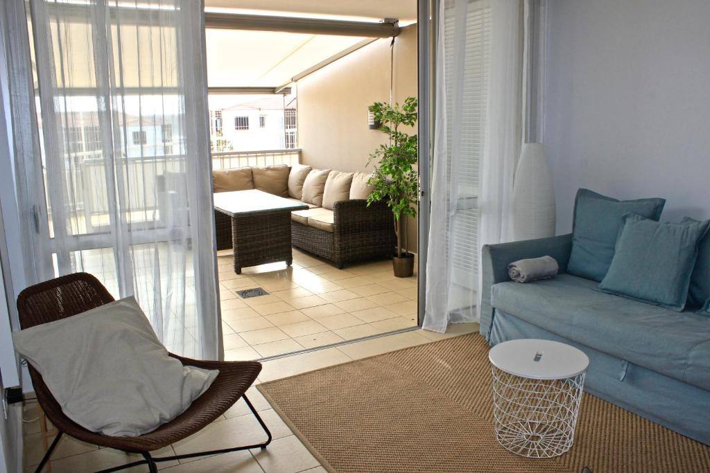a living room with a couch and a table at Brilliant 2BDR Apartment in Poris de Abona