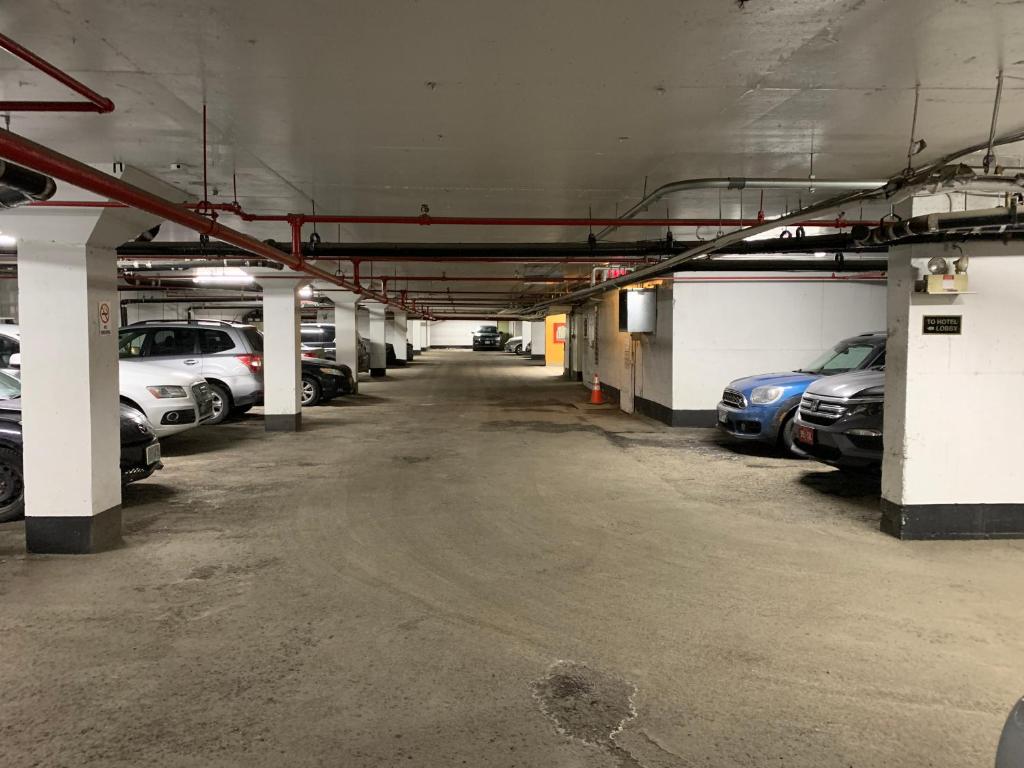 a large parking garage with cars parked in it at The Business Inn in Ottawa
