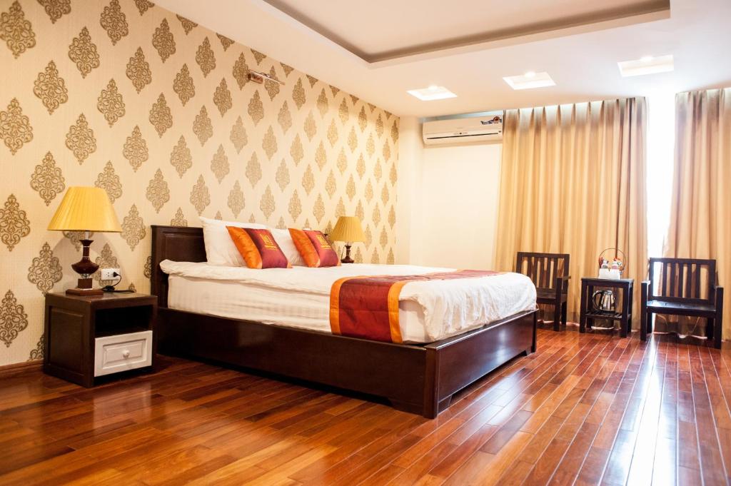 Postel nebo postele na pokoji v ubytování Mely Hotel Hà Nội