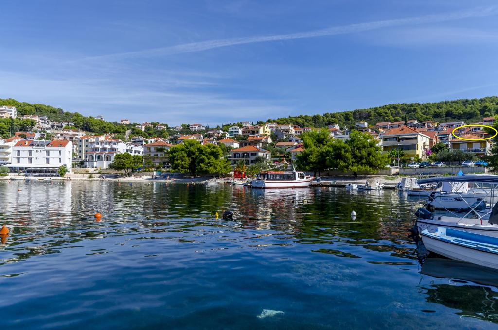 a group of boats are docked in a harbor at Apartment Buksa in Trogir