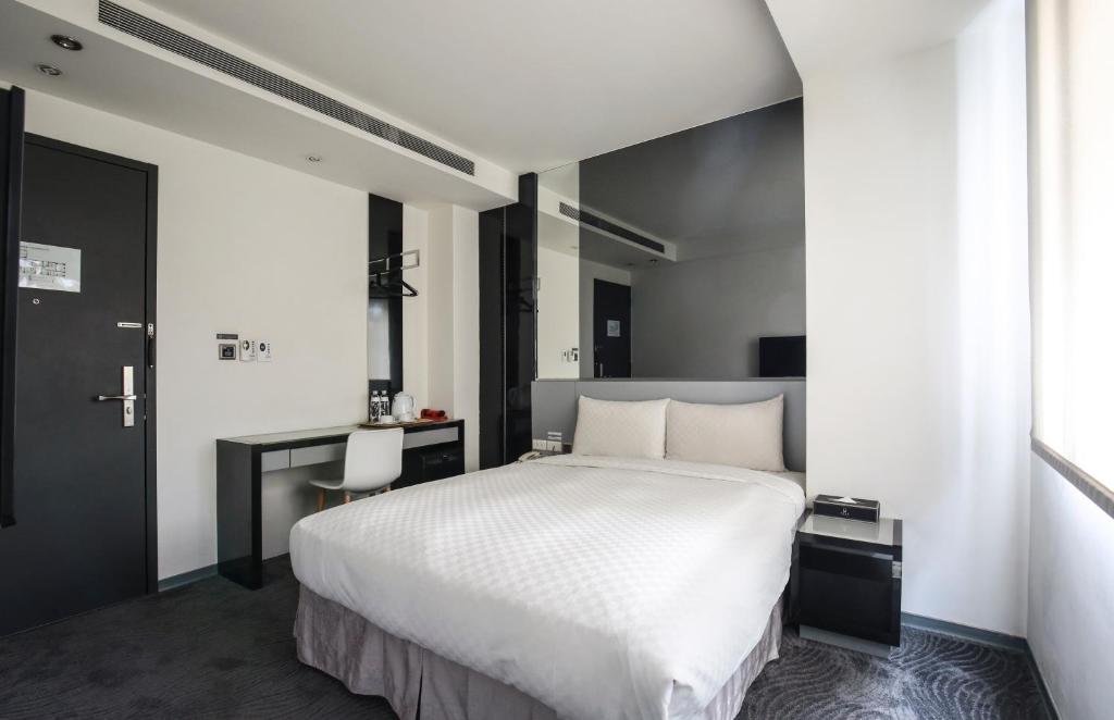 Postel nebo postele na pokoji v ubytování CityInn Hotel Plus - Taichung Station Branch
