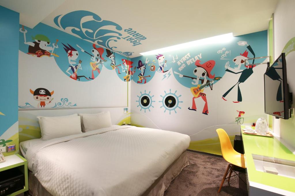 Postel nebo postele na pokoji v ubytování CityInn Hotel Plus - Taichung Station Branch