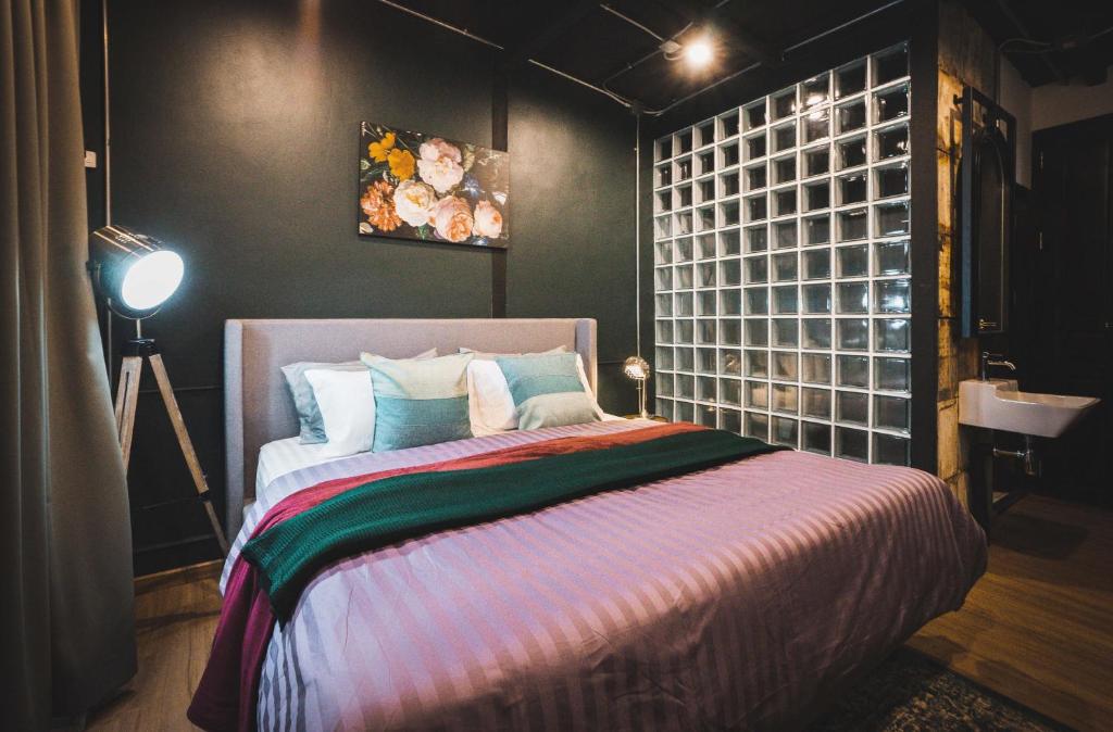 Letto o letti in una camera di Mojo Old Town Phranakorn