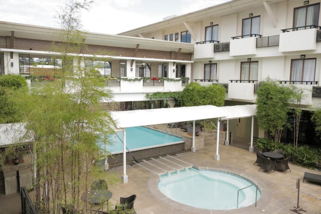 an aerial view of the courtyard of a hotel with a swimming pool at Mansion Garden Hotel in Olongapo