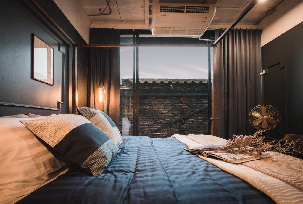 Letto o letti in una camera di Mojo Old Town Phranakorn