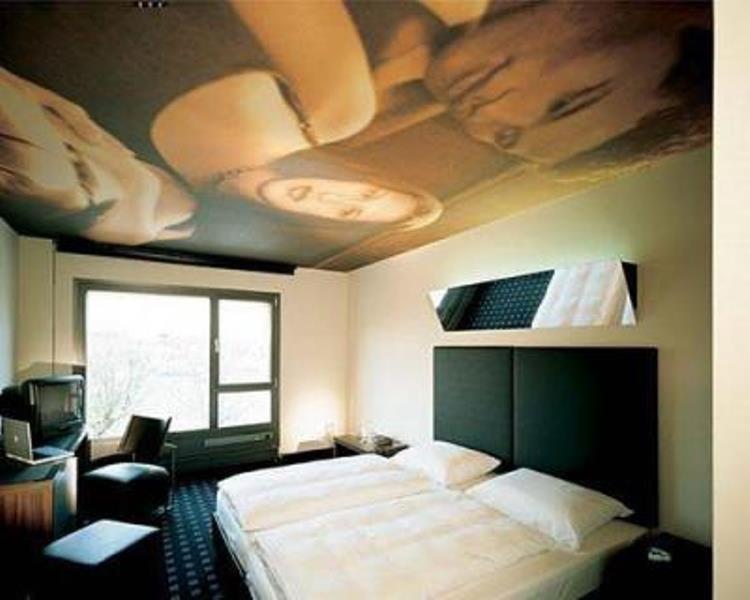 Ein Bett oder Betten in einem Zimmer der Unterkunft Kult Hotel