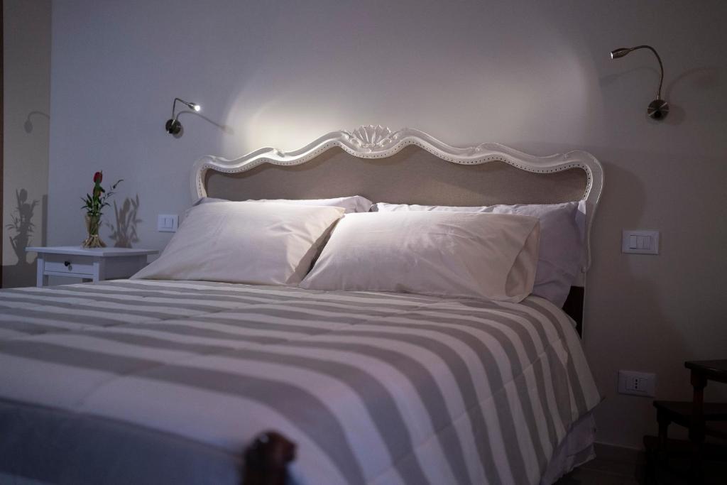 Postel nebo postele na pokoji v ubytování Il Palazzetto