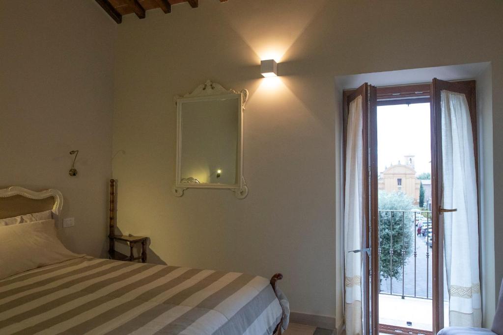 Postel nebo postele na pokoji v ubytování Il Palazzetto