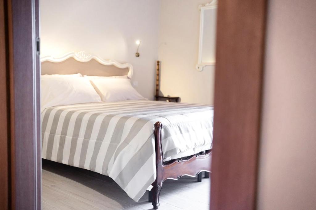 Postel nebo postele na pokoji v ubytování Il Palazzetto