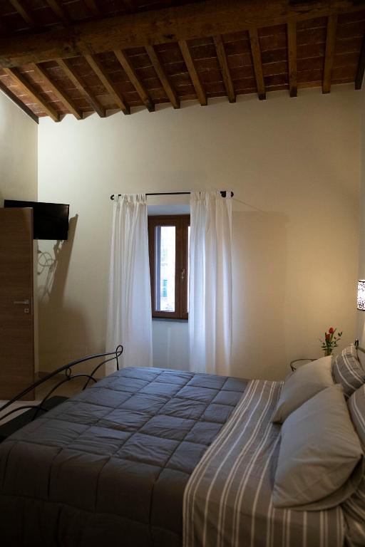 Postel nebo postele na pokoji v ubytování Il Palazzetto