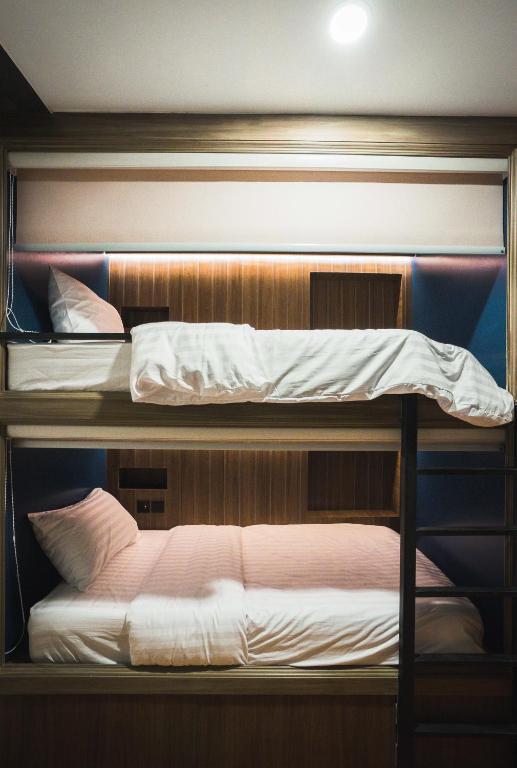 Letto o letti in una camera di Mojo Old Town Phranakorn