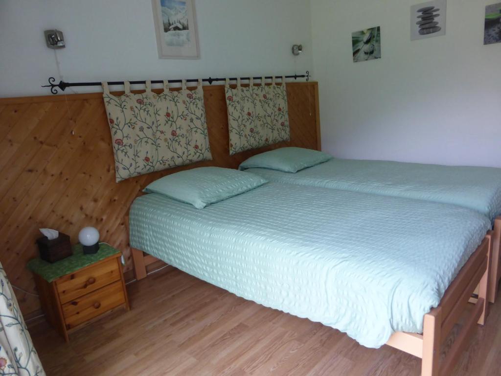 Postel nebo postele na pokoji v ubytování B&B Les Acacias