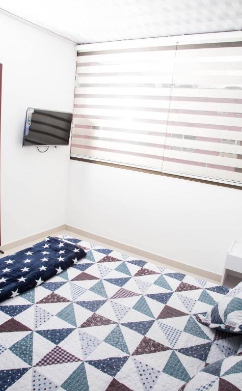 Postel nebo postele na pokoji v ubytování Hotel Las Colonias