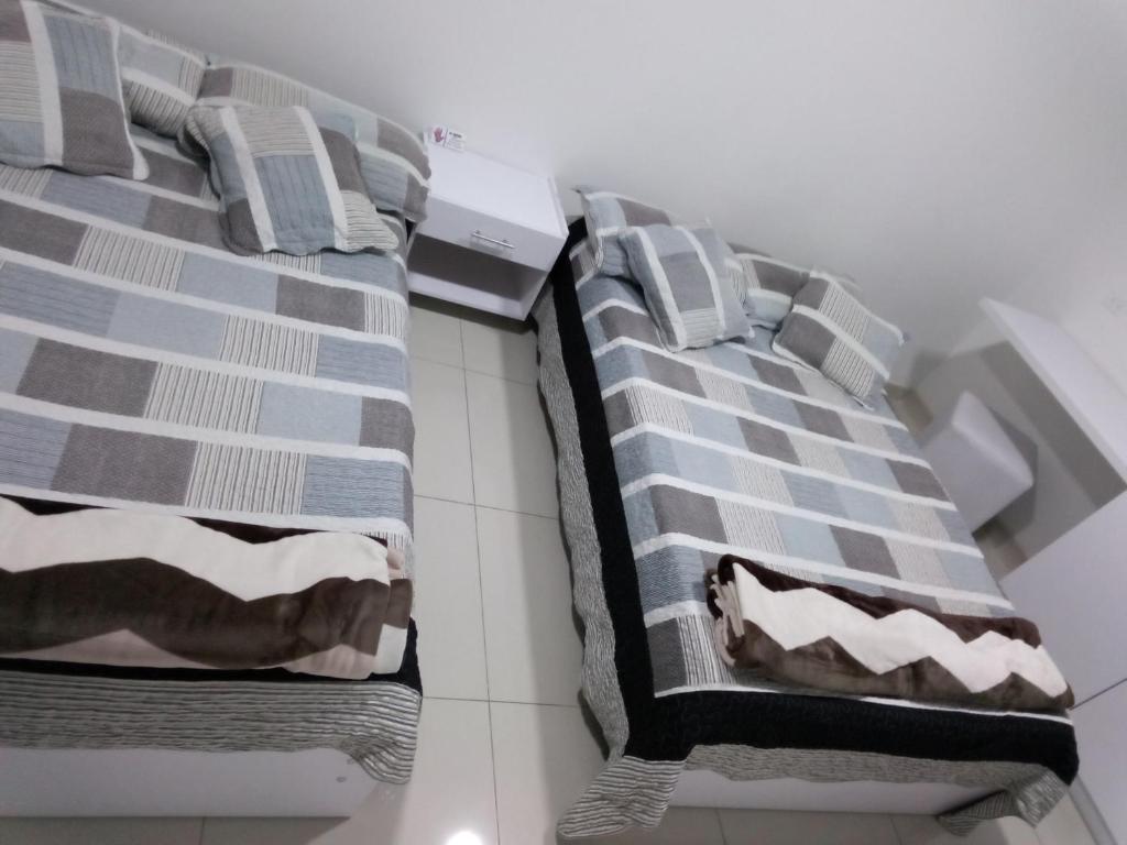 Postel nebo postele na pokoji v ubytování Hotel Las Colonias