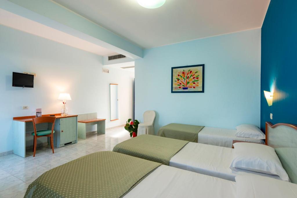 En eller flere senge i et værelse på Atlantis Palace Hotel