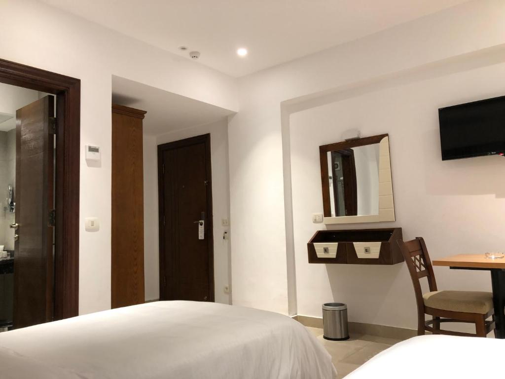 TV a/nebo společenská místnost v ubytování Maxim Hotel