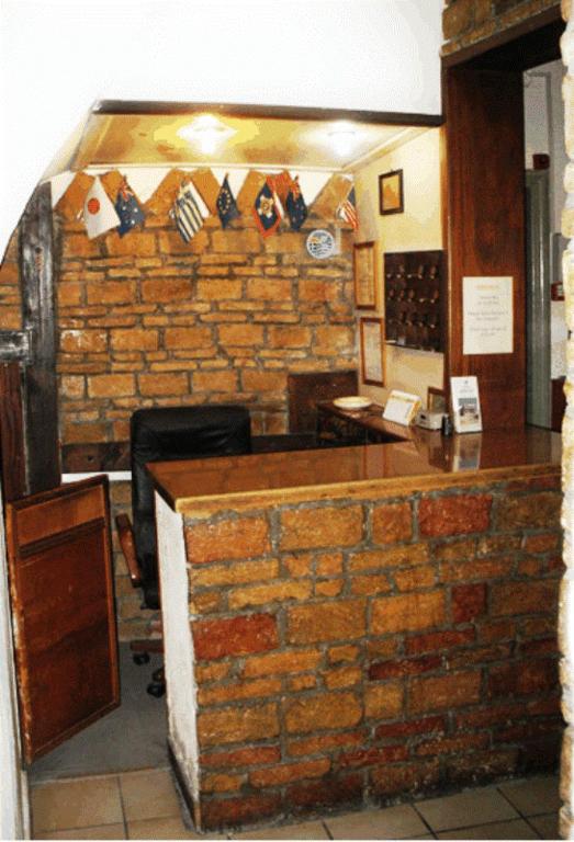 Kuchyň nebo kuchyňský kout v ubytování Argo Hotel