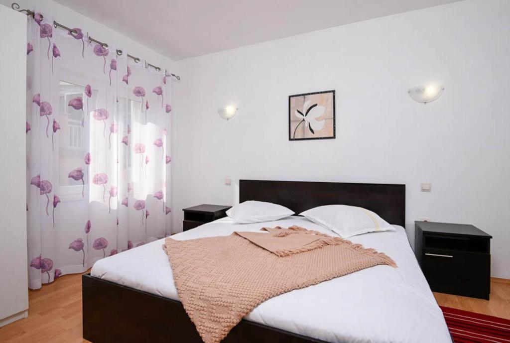 Posteľ alebo postele v izbe v ubytovaní Apartments Andrija Orebić