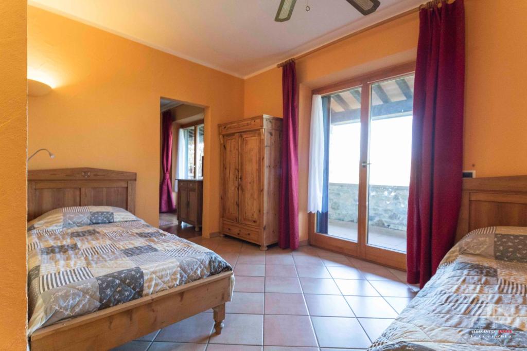 Postel nebo postele na pokoji v ubytování Villa Sant Anna