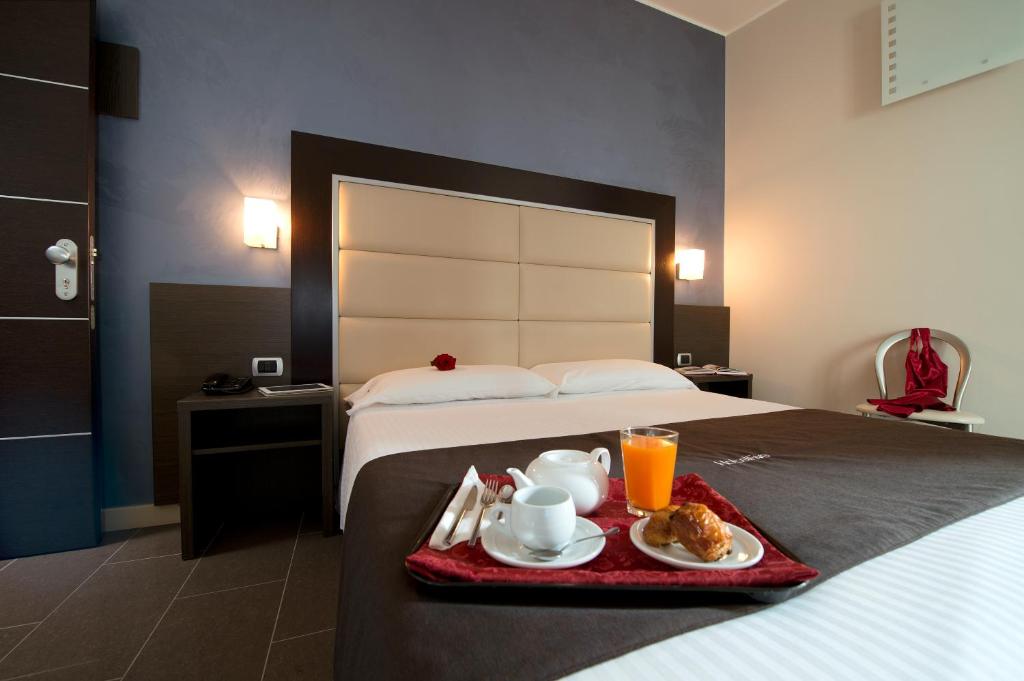 Postel nebo postele na pokoji v ubytování Hotel Five