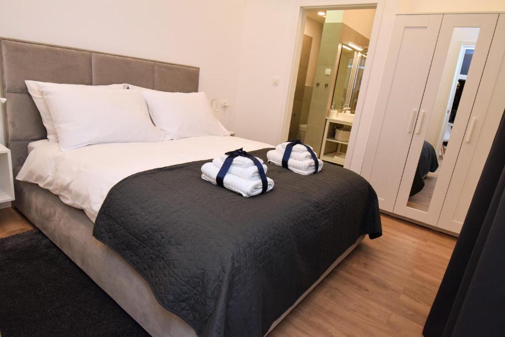 Posteľ alebo postele v izbe v ubytovaní ZAGRABY APARTMENT