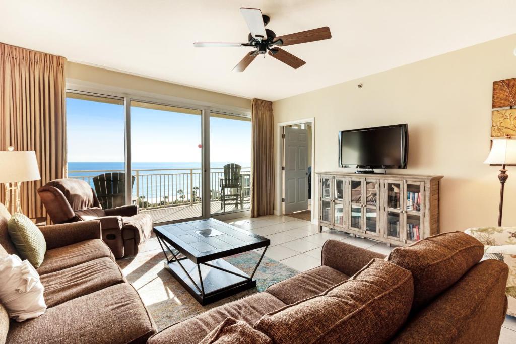 a living room with a couch and a tv at Sterling Shores 807 Destin (Condo) in Destin