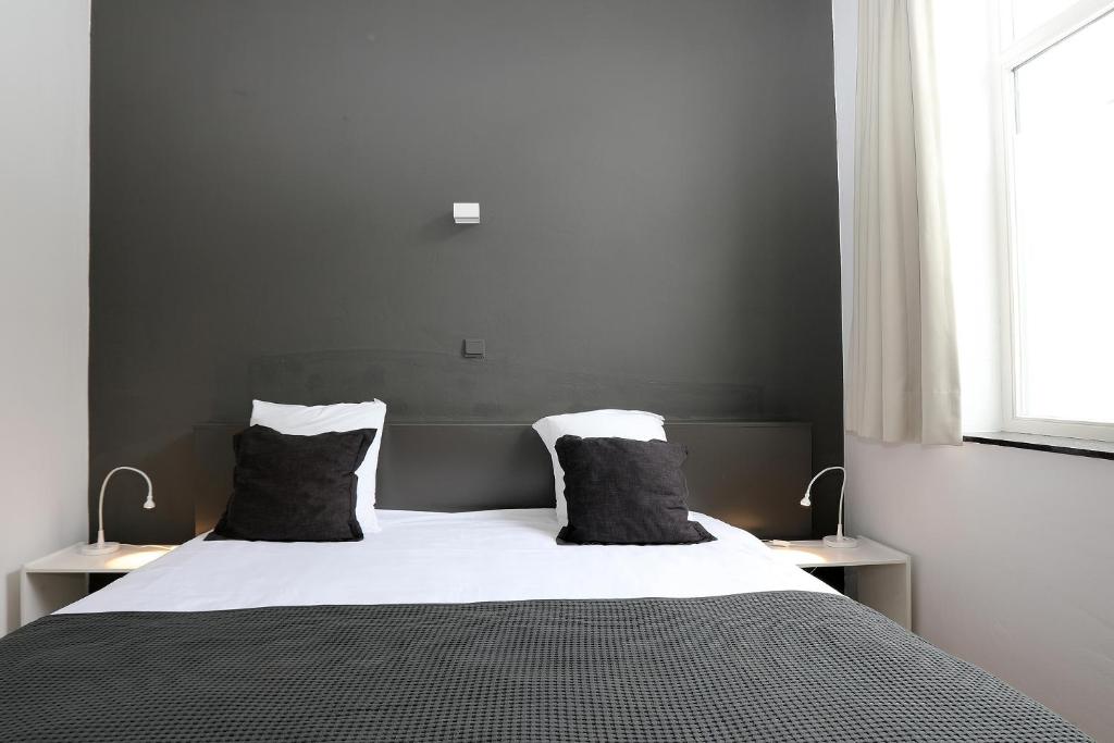 Postel nebo postele na pokoji v ubytování Hotel De Loft