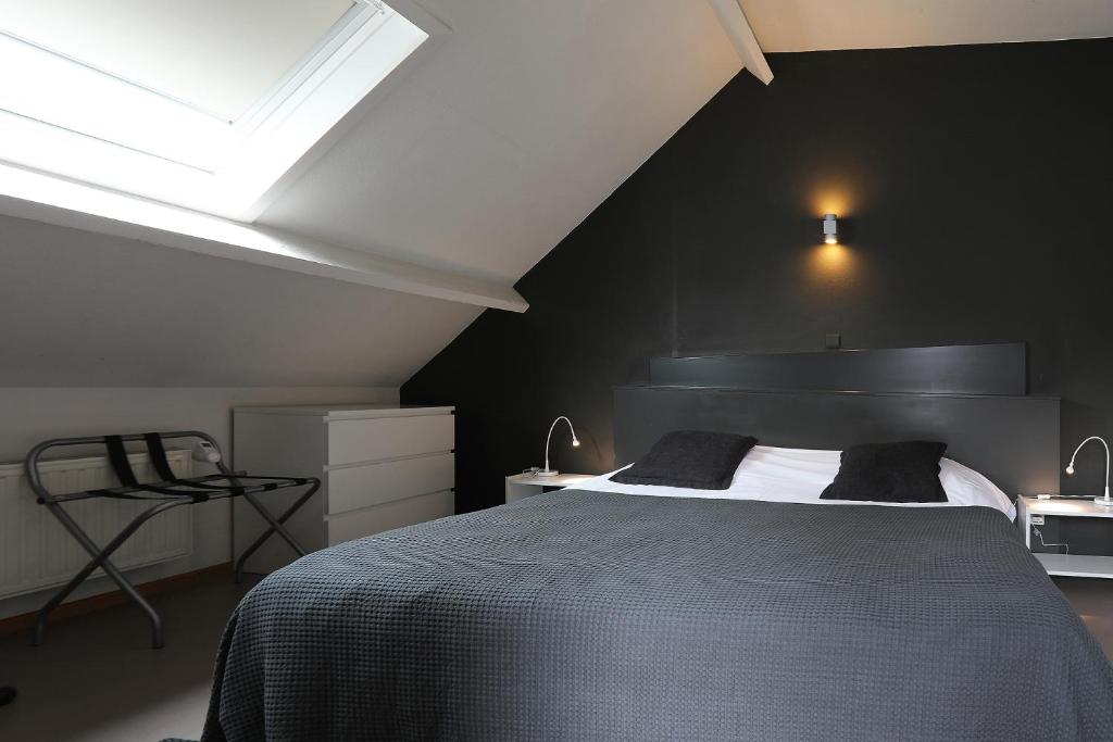 Postel nebo postele na pokoji v ubytování Hotel De Loft