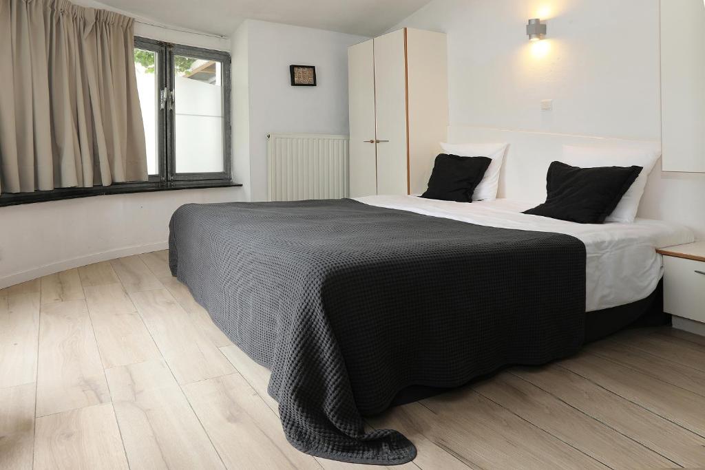 Postel nebo postele na pokoji v ubytování Hotel De Loft