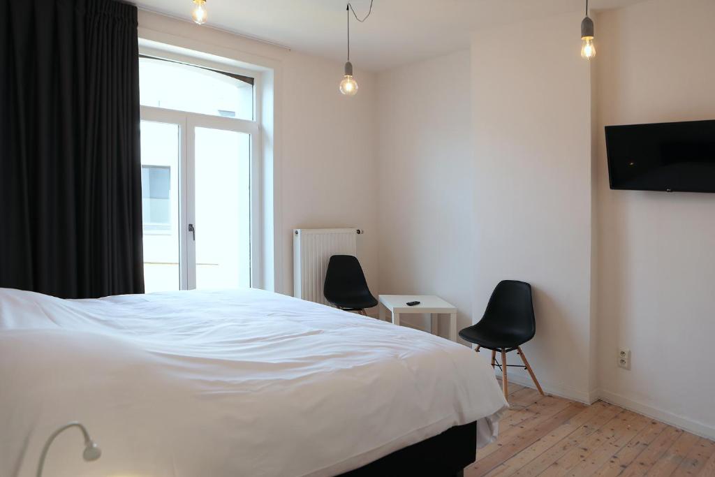 TV a/nebo společenská místnost v ubytování Hotel De Loft
