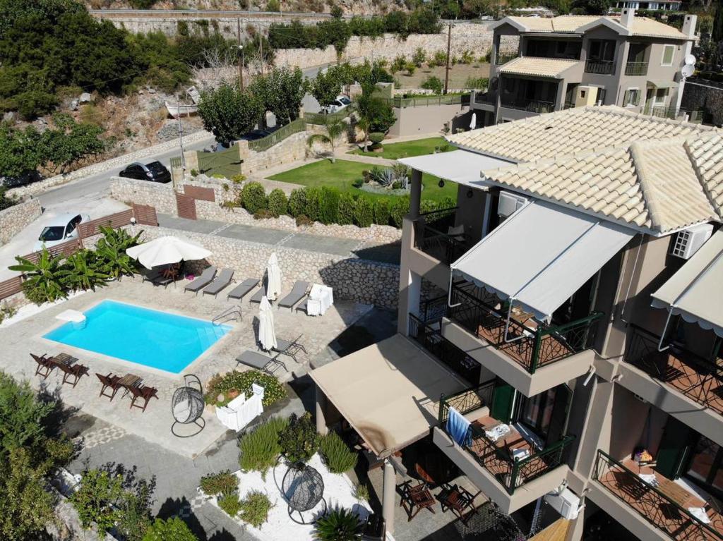 an aerial view of a house with a swimming pool at Katarina Apartments in Kefallonia
