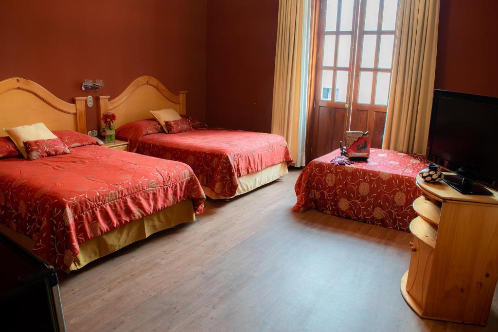 Voodi või voodid majutusasutuse Hotel Inka Path toas